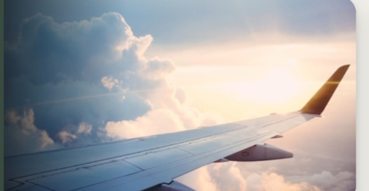 Aircraft wing above clouds